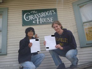 Mikey and J outside the Grassroots House in Oakland showing letter to Barbara Lee in wake of Operation Protective Edge