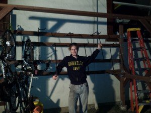 Mikey stands next to a bicycle rack in Berkeley, CA