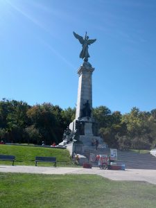 Mikey's bicycle is shown leaning against a monument at Mount Royal in Montreal, Canada