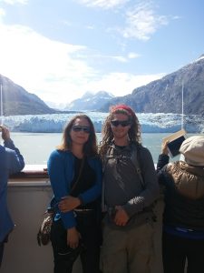 Mikey & S smile for the camera with the Margerine Glacier in the background