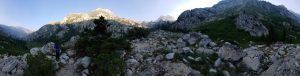 Mikey stands on a rocky mountaintop in the high sierras