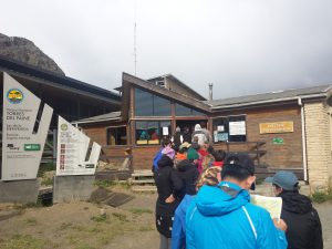 A queue of people are lined up to get enterance to Torres Del Paine national park