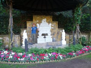 Mikey stands next to the sarcophagus holding Mahatma Gandhi's ashes in Los Angeles